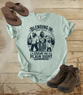 A comfort colors bay color graphic t-shirt featuring a dark blue bigfoot-themed outdoor print that reads 'Blending In: Basic Skills. Hide in Plain Sight.
